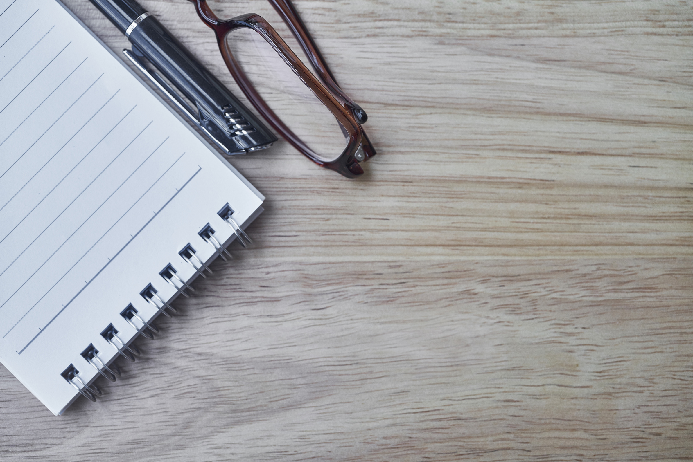 Notebook and Pen on a Desk